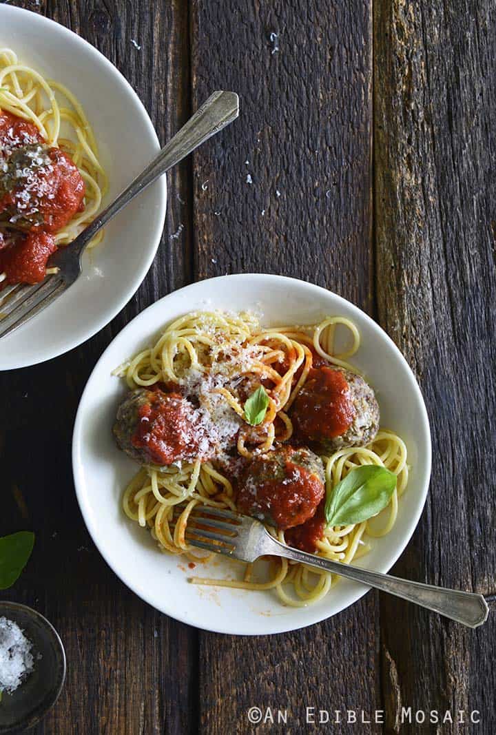 Traditional Meatballs with Spaghetti Noodles and Tomato Sauce on White Plates