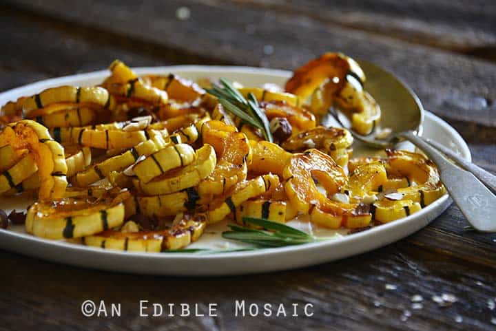 Roasted Delicata Squash on Serving Platter on Dark Wood Table