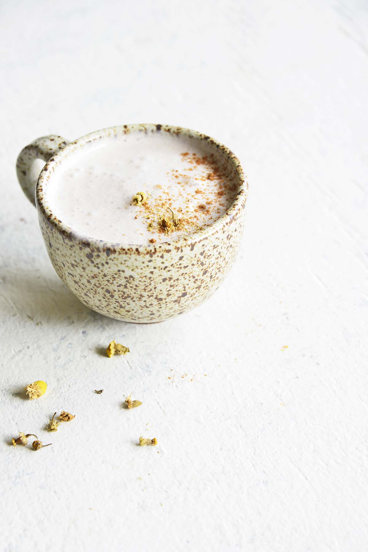 chamomile tea latte in stone mug