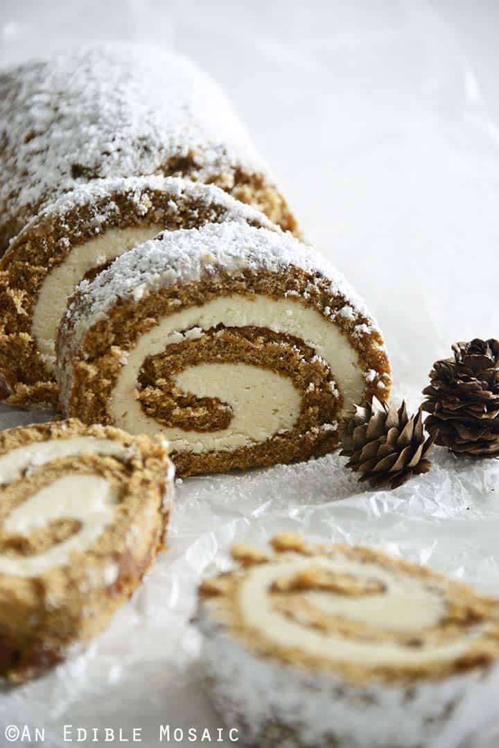 Front View of Gingerbread Roll Cake Log on White Table