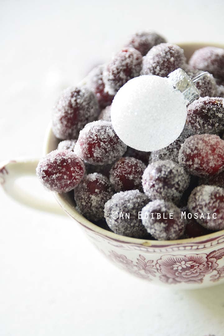 Close Up of Sugared Cranberries with Frosted White Ornament