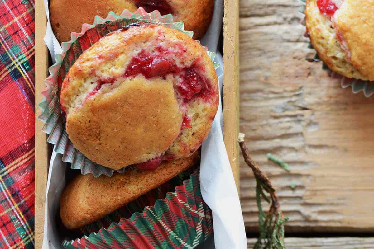 close up top view of eggnog muffin filled with cranberry sauce