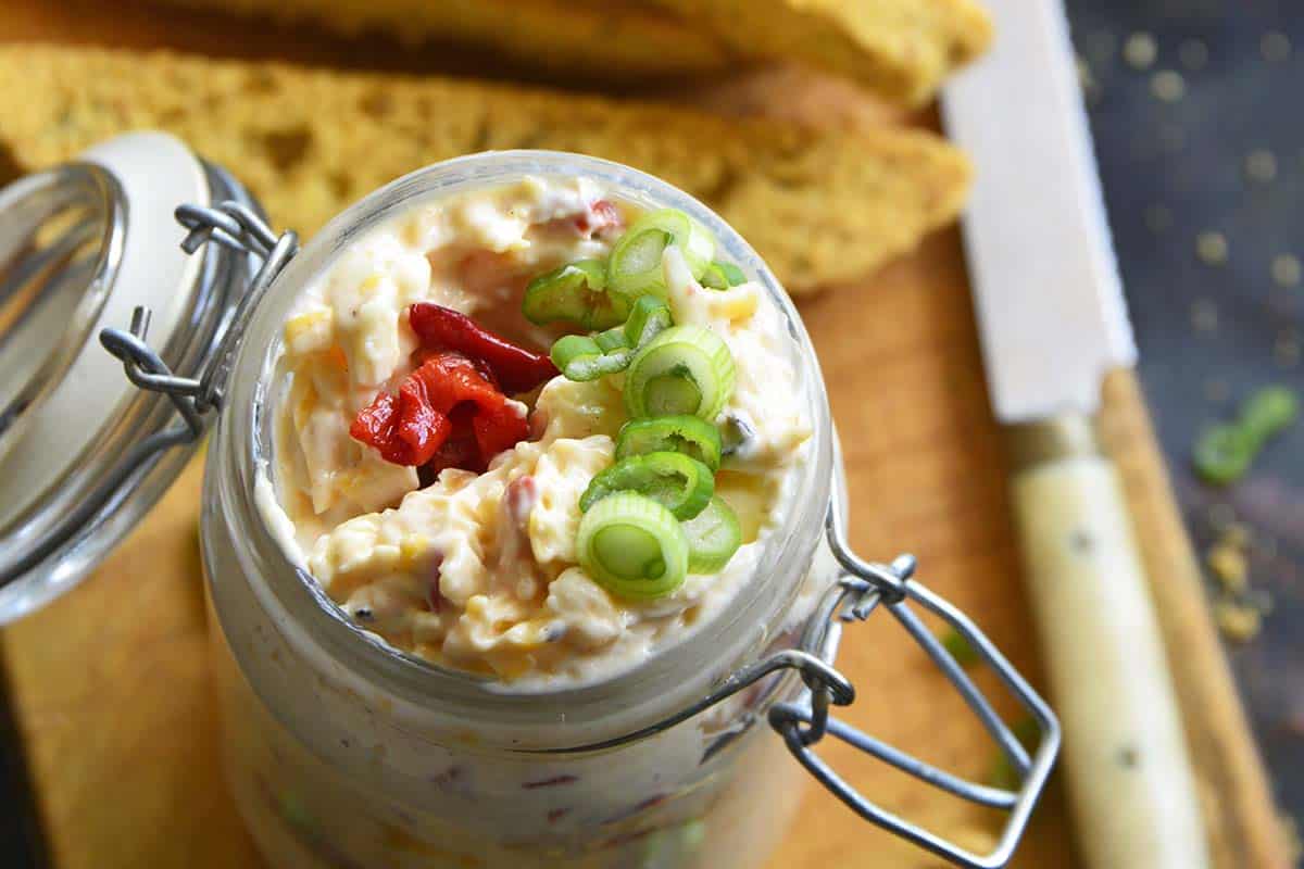 close up top view of pimento cheese in jar for serving