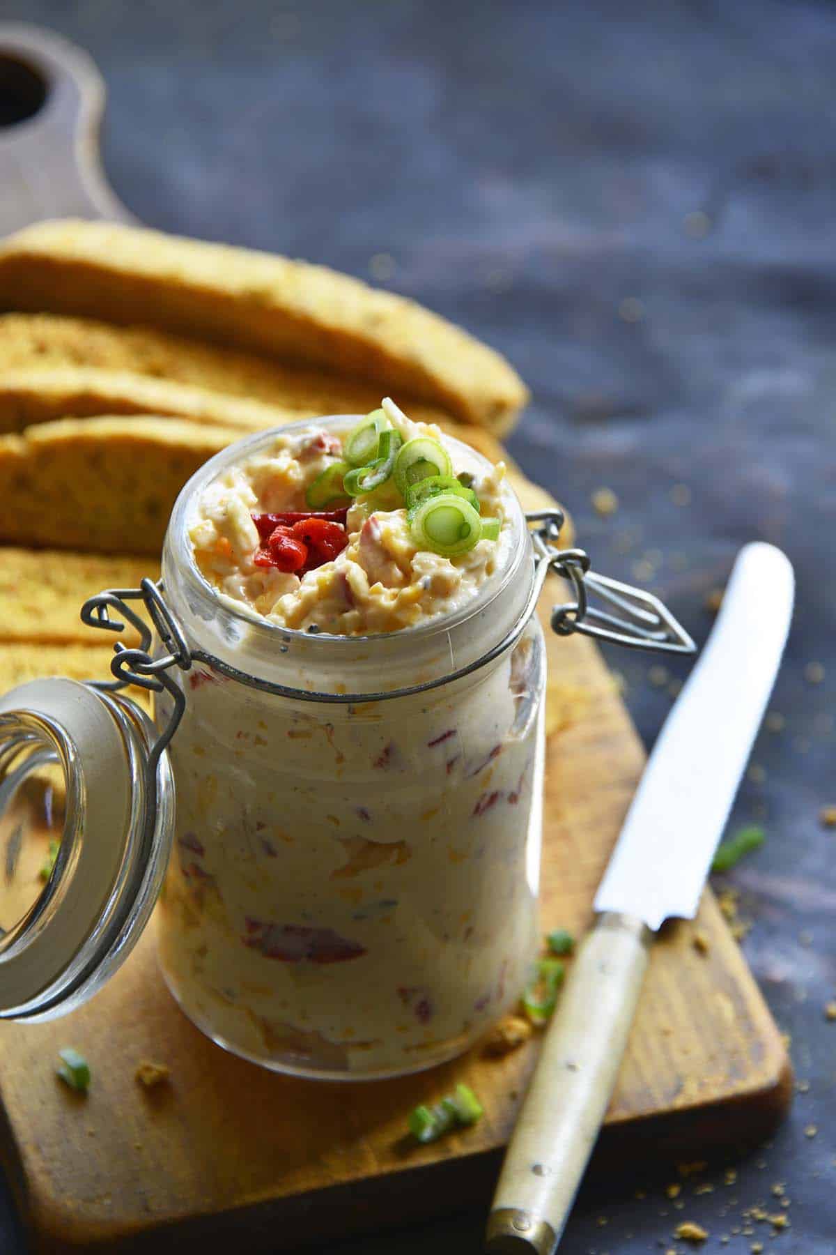 front view of pimento cheese spread in glass jar