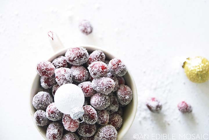 top view of sugared cranberries with sparkly frosted ornaments