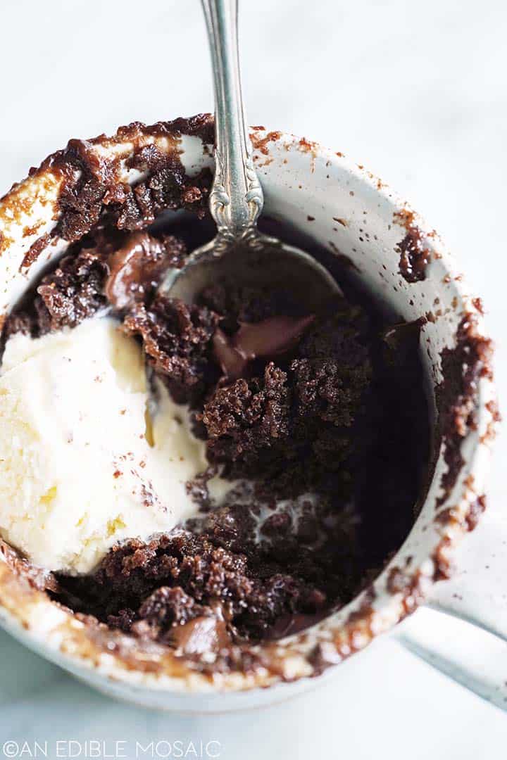 decadent chocolate mug cake topped with vanilla ice cream