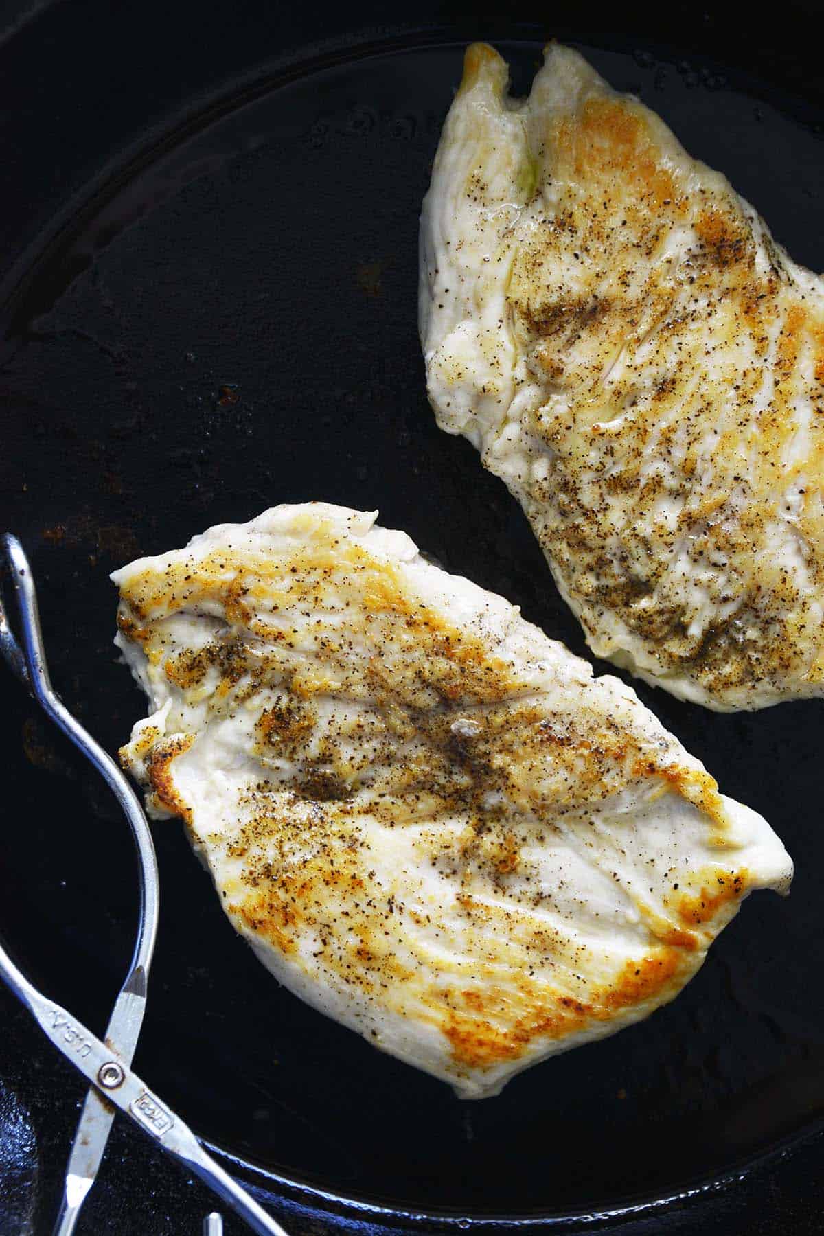 pan seared chicken breast cutlets in cast iron skillet