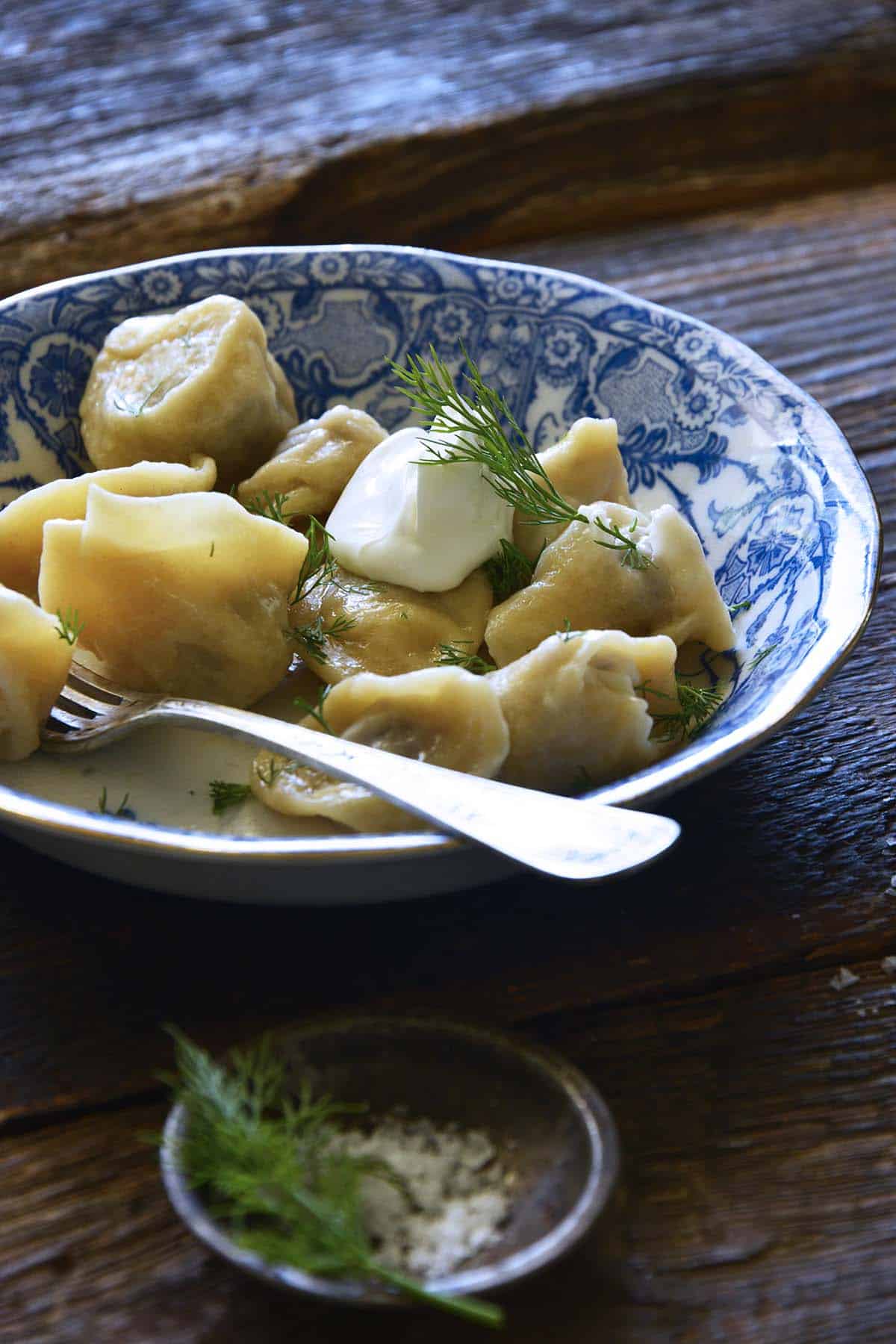 pelmeni dumplings served with smetana