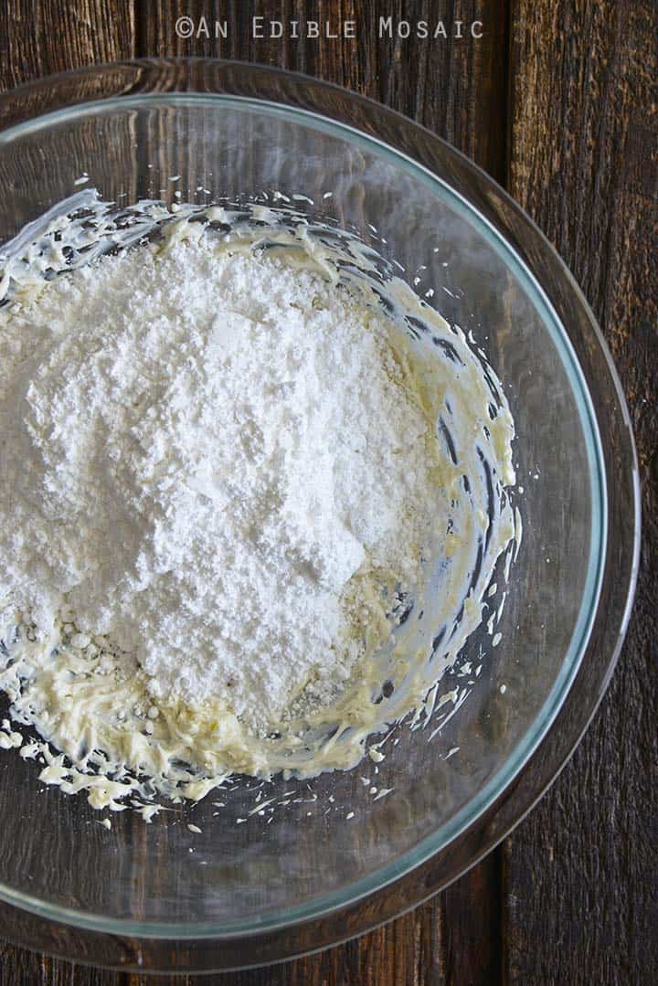 Adding Powdered Sugar to Creamed Butter and Cream Cheese