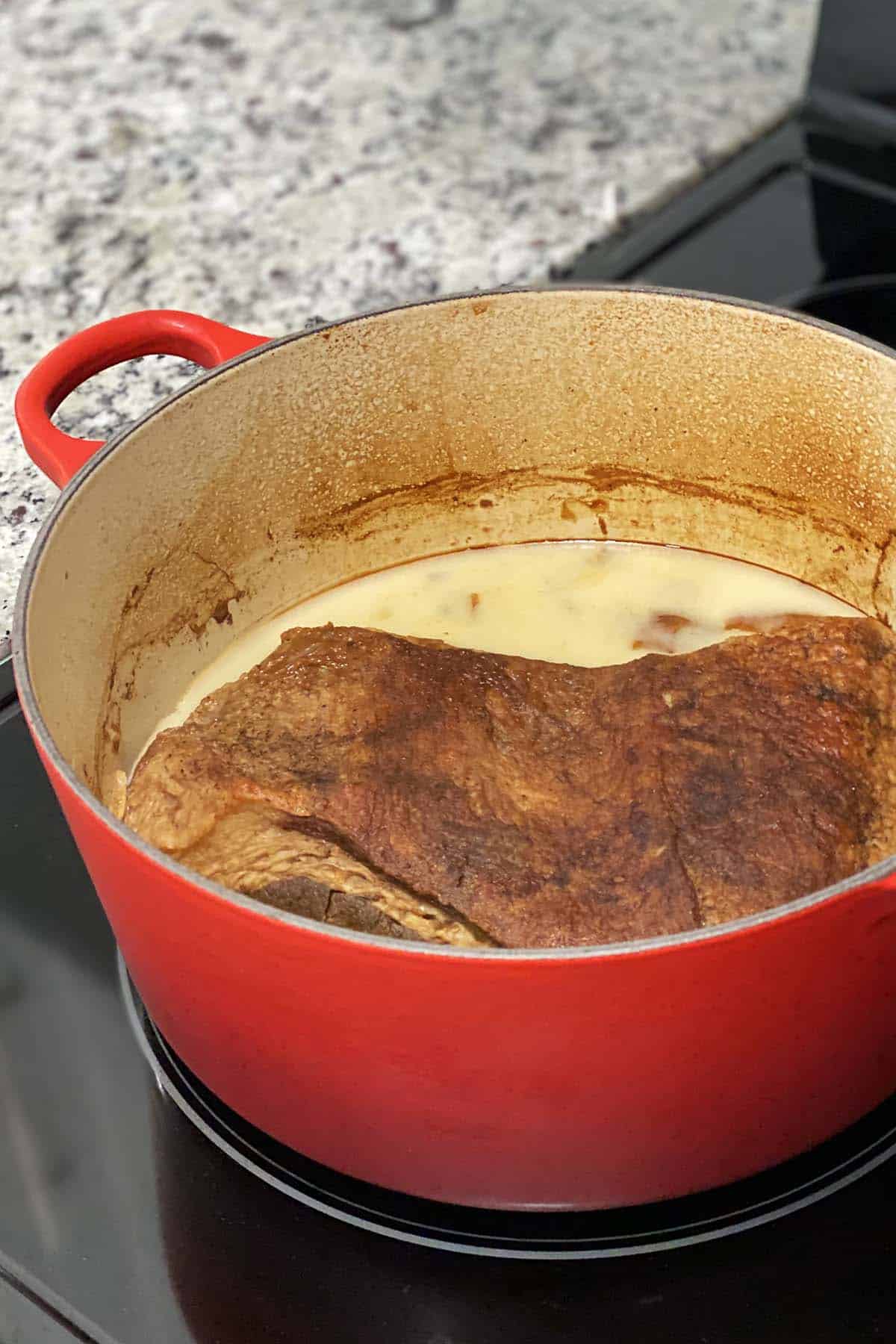 cooked chilled brisket with fat hardened on top