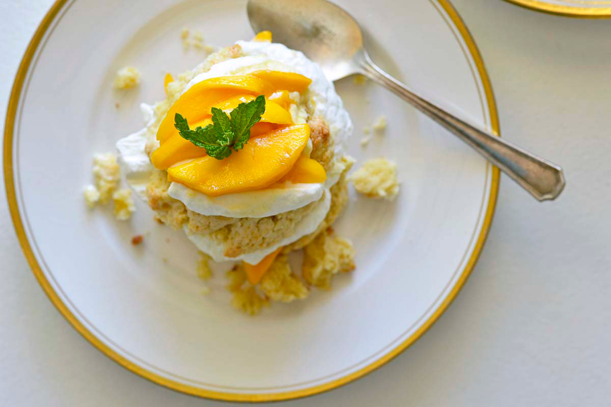 mango shortcake dessert on plates on white table