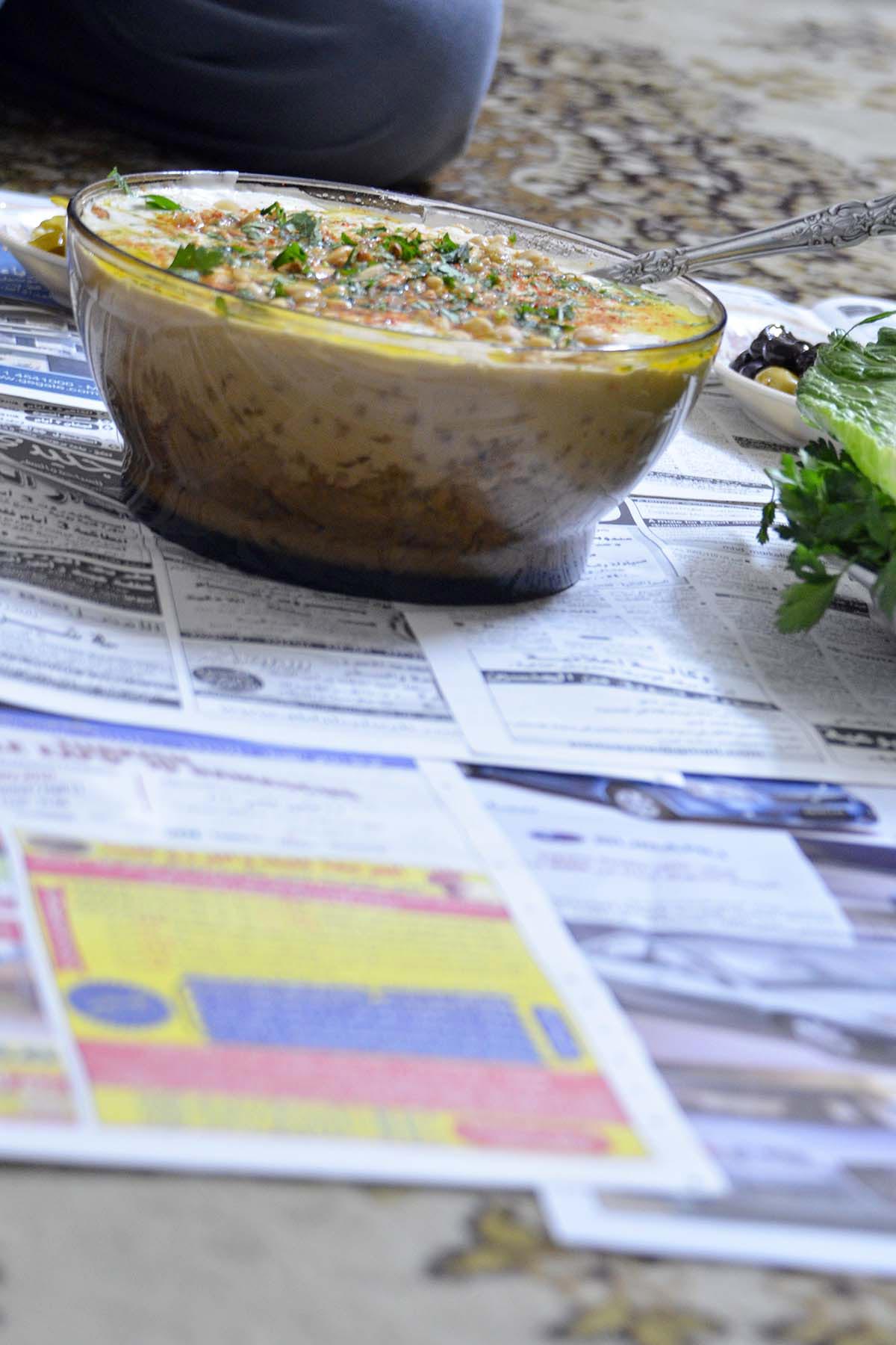 tissiyeh meal served on newspapers on the floor in Damascus Syria