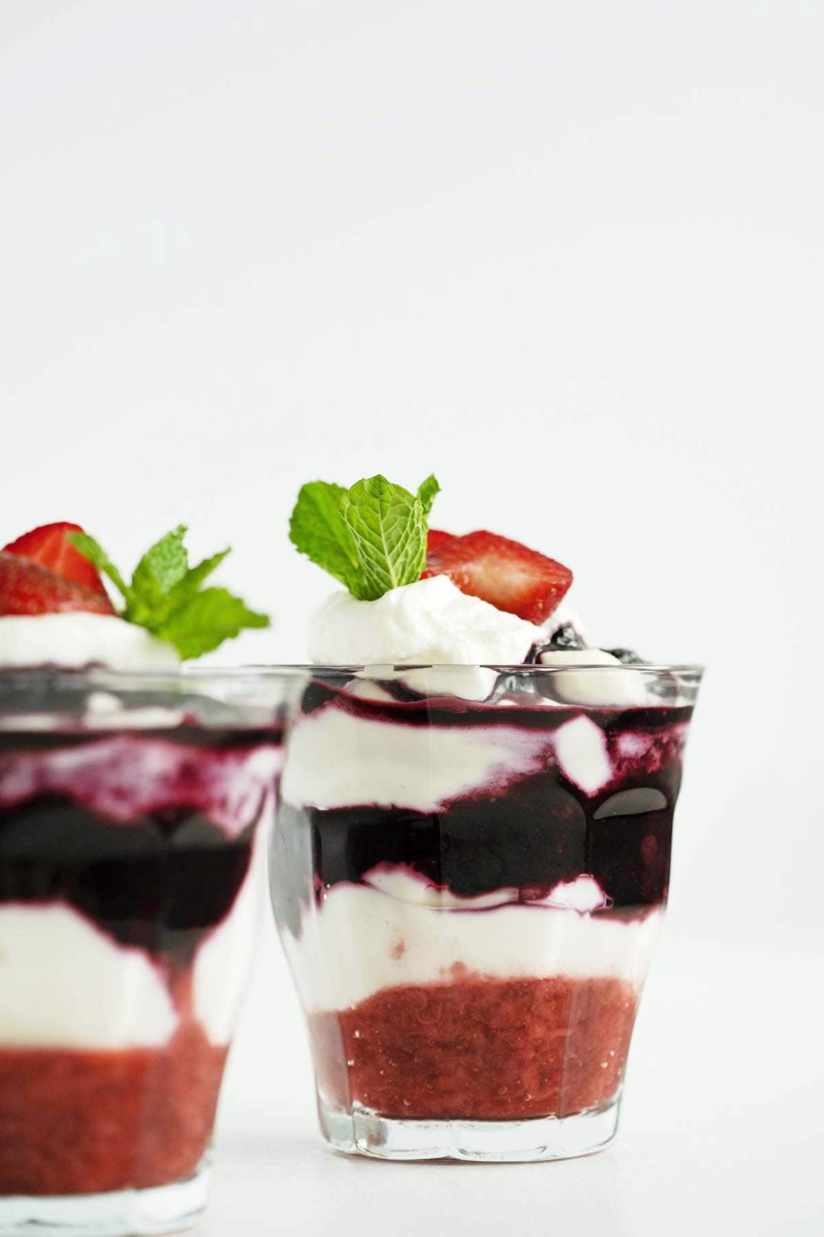 cheesecake mousse recipe layered with berry sauce