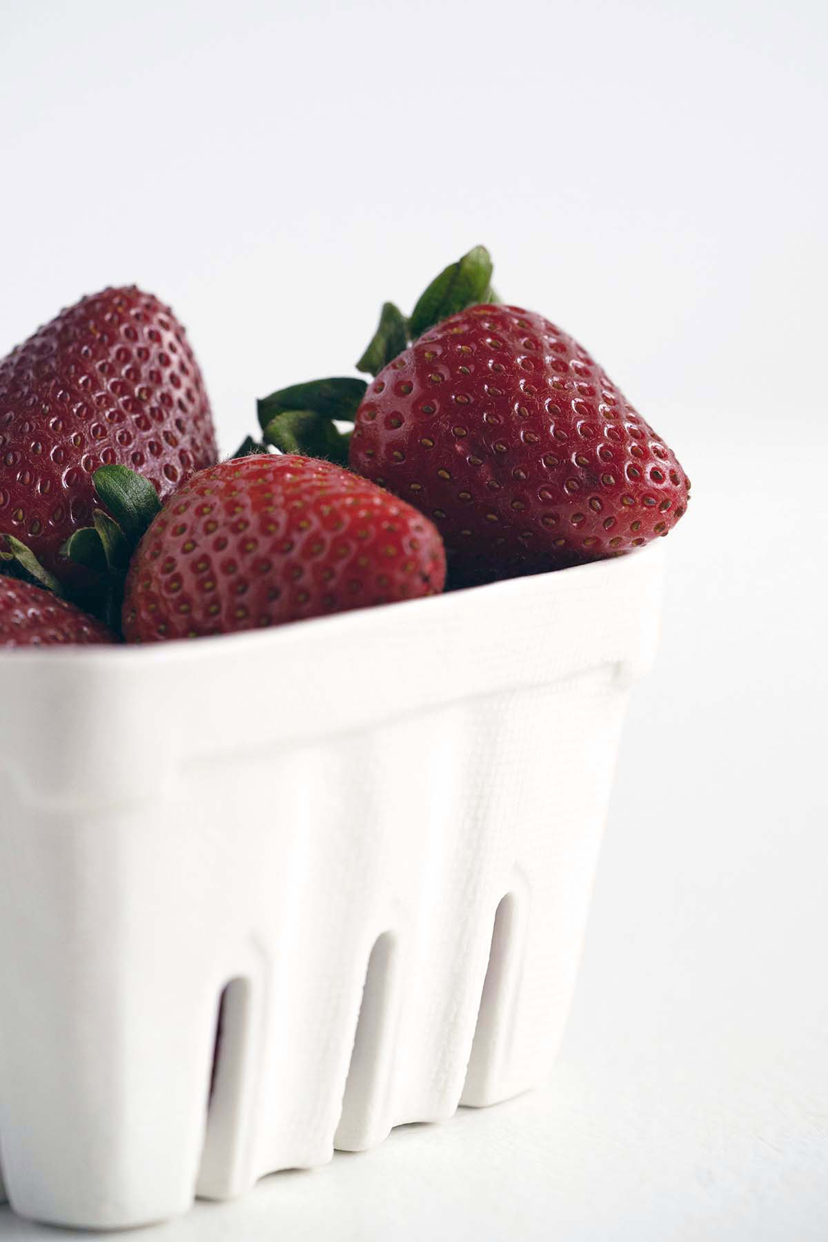 fresh strawberries in white basket