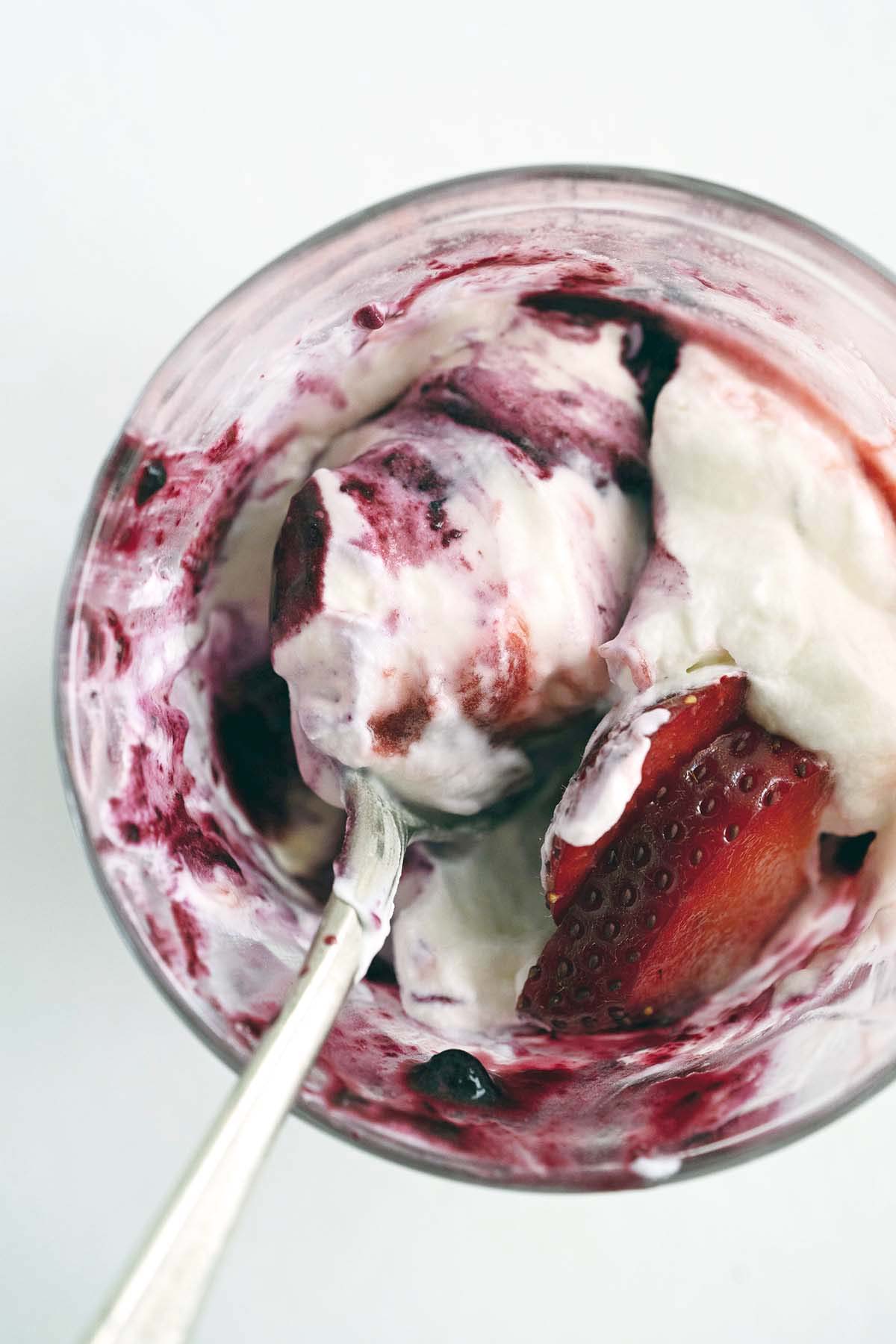 partially eaten fresh berry no bake cheesecake parfait
