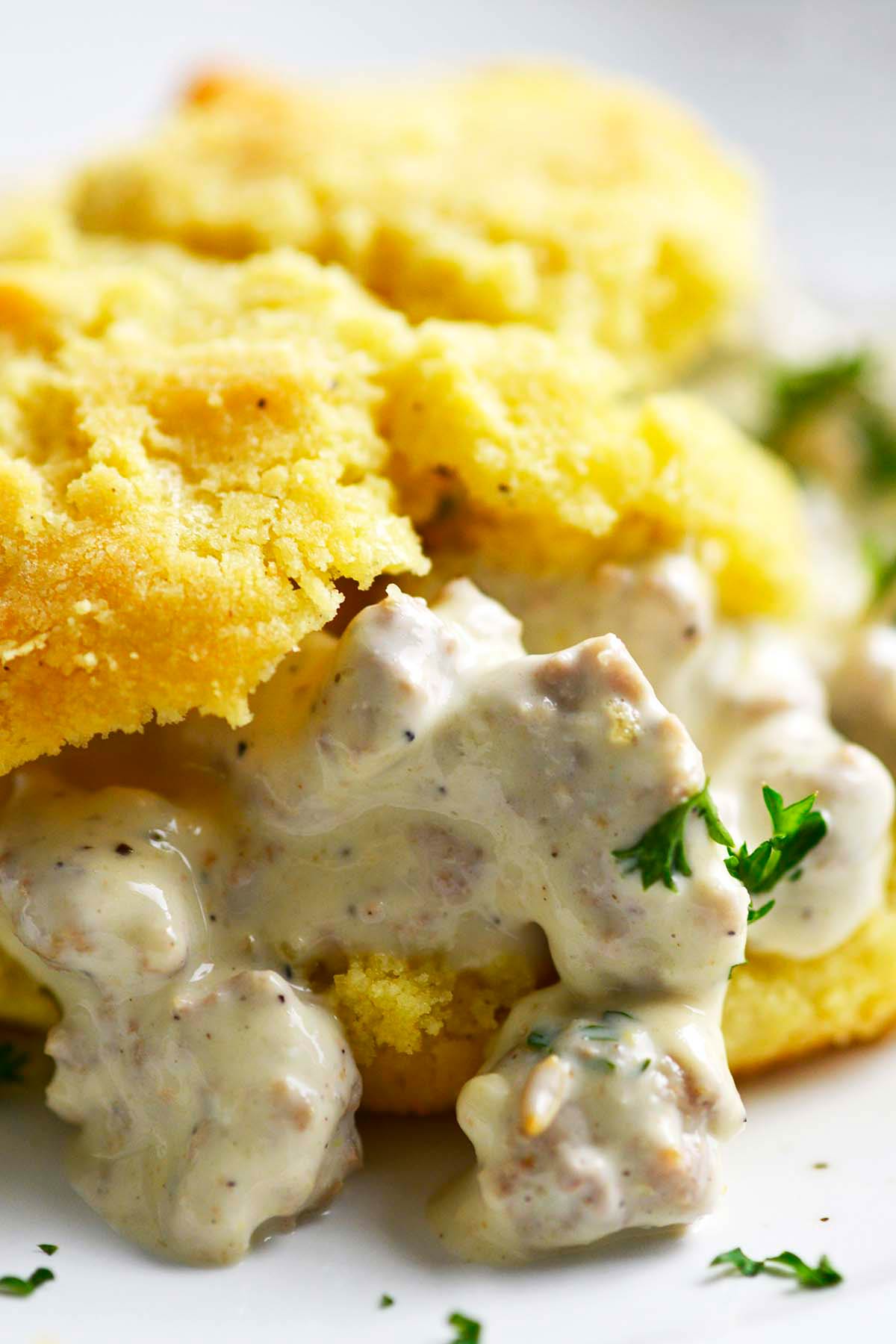 close up front view of keto biscuit with low carb sausage gravy recipe