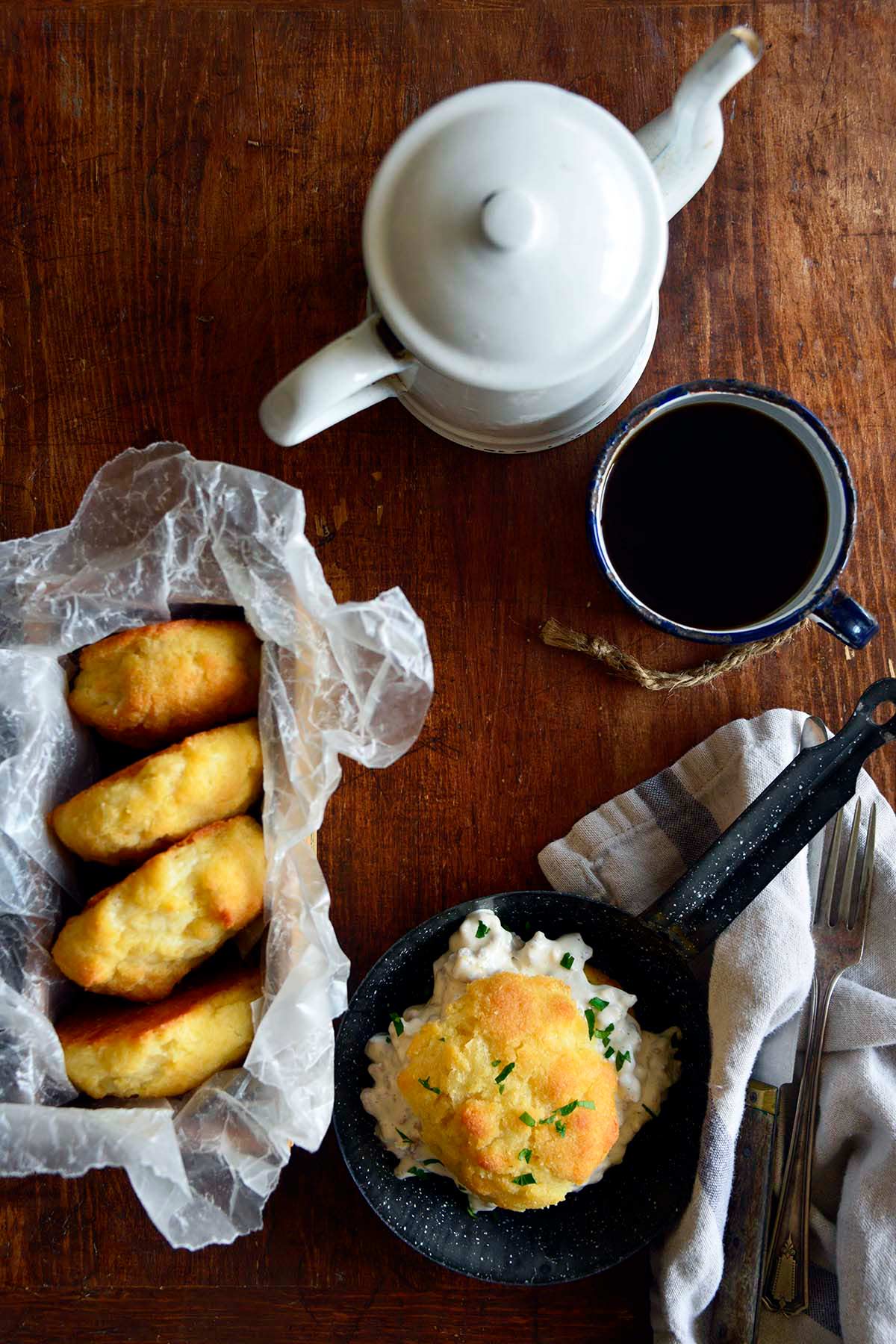 low carb breakfast spread with biscuits sausage gravy and coffee