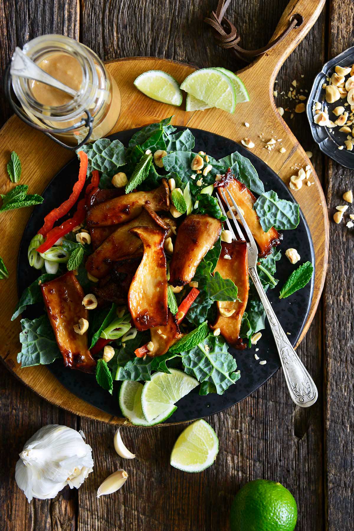 sweet and savory soy glazed mushrooms kin kale salad with tahini dressing