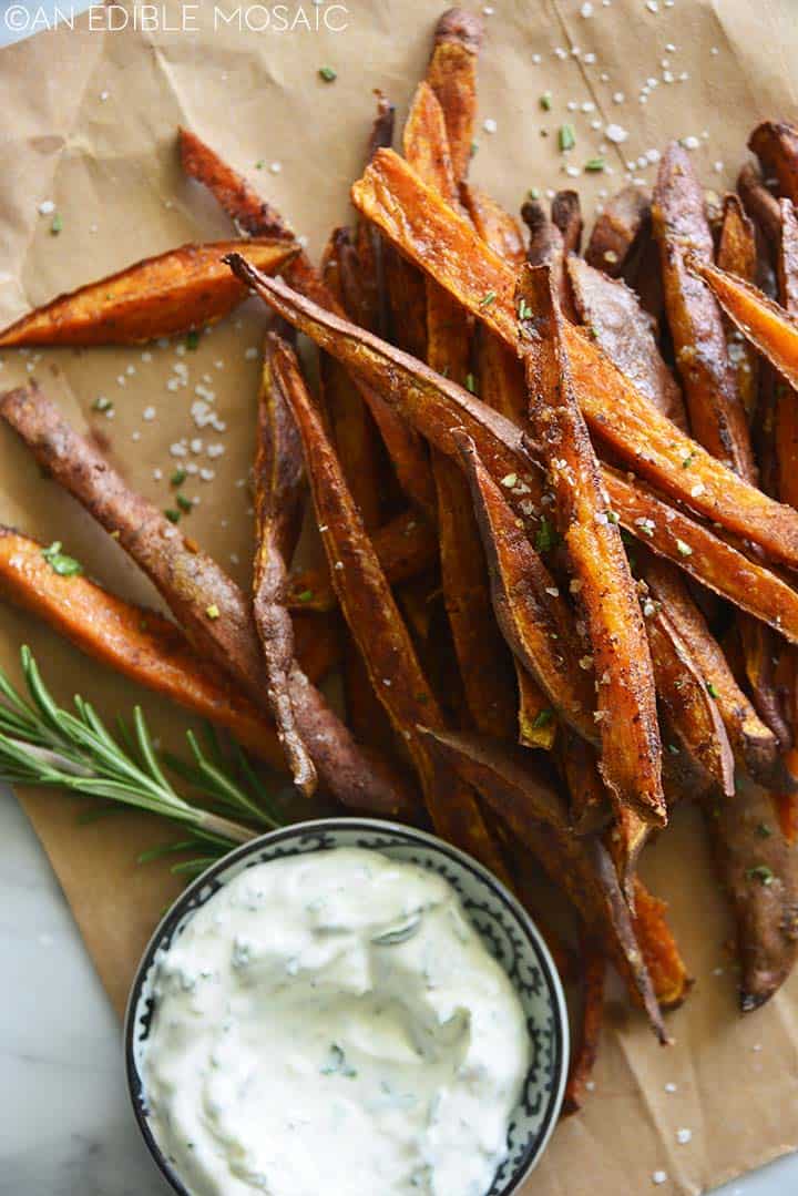 sweet potato fries recipe on brown paper with creamy dip