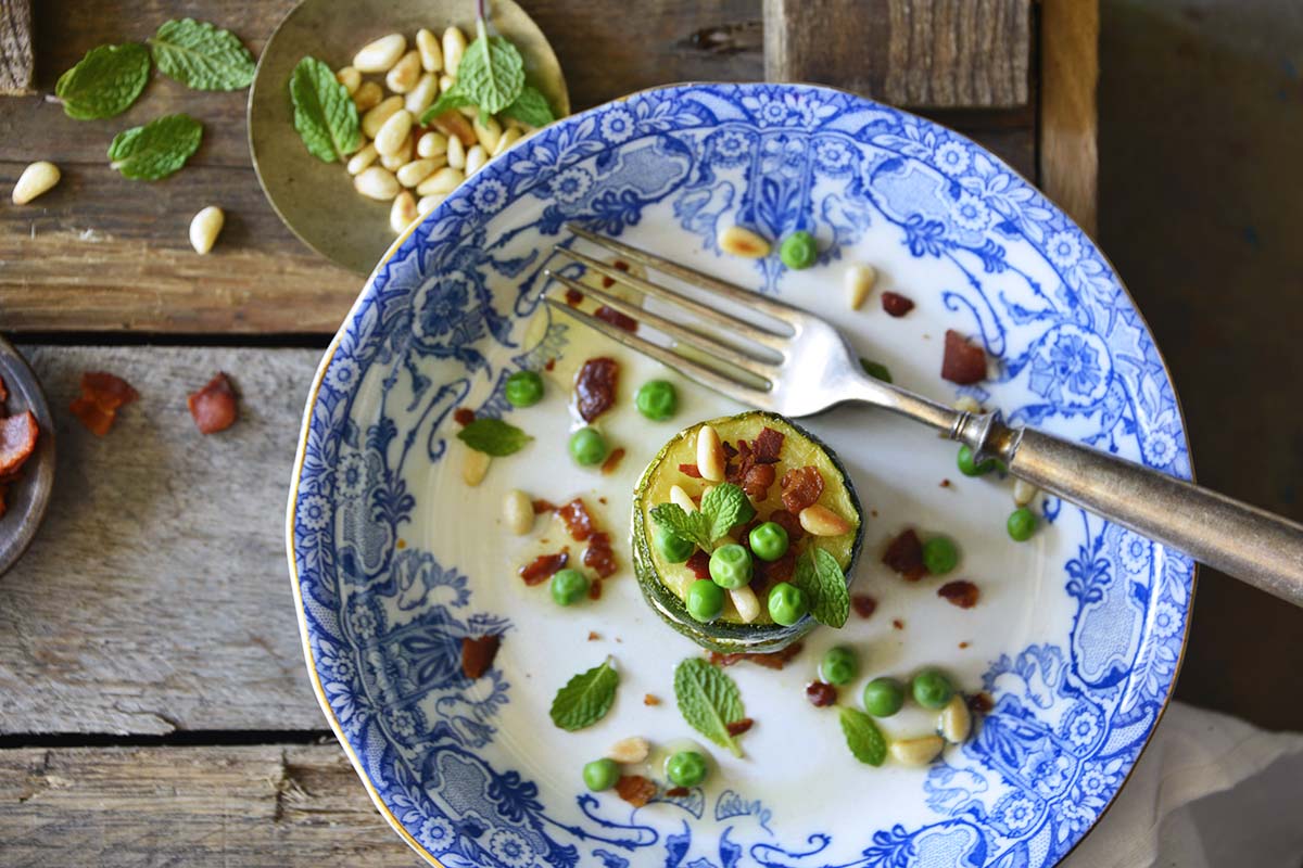 zucchini appetizer stack with bacon and pine nuts