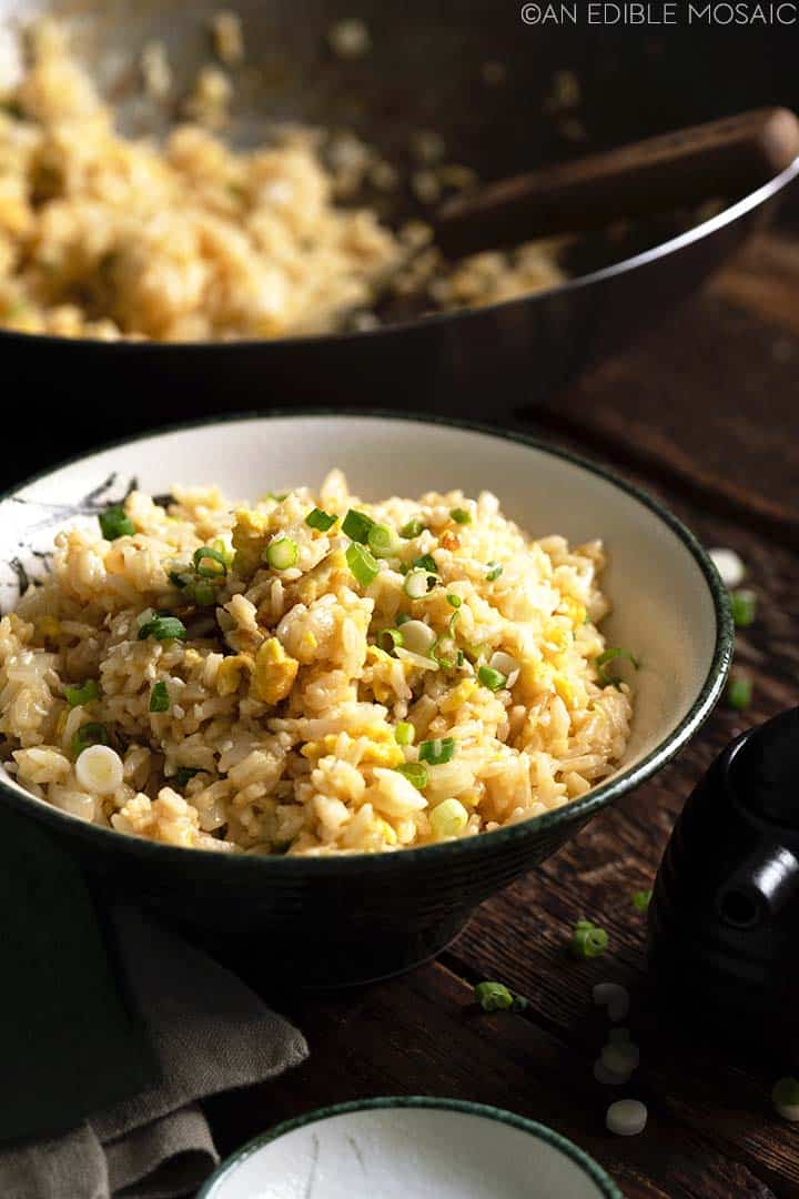 japanese fried rice in bowl with wok in background