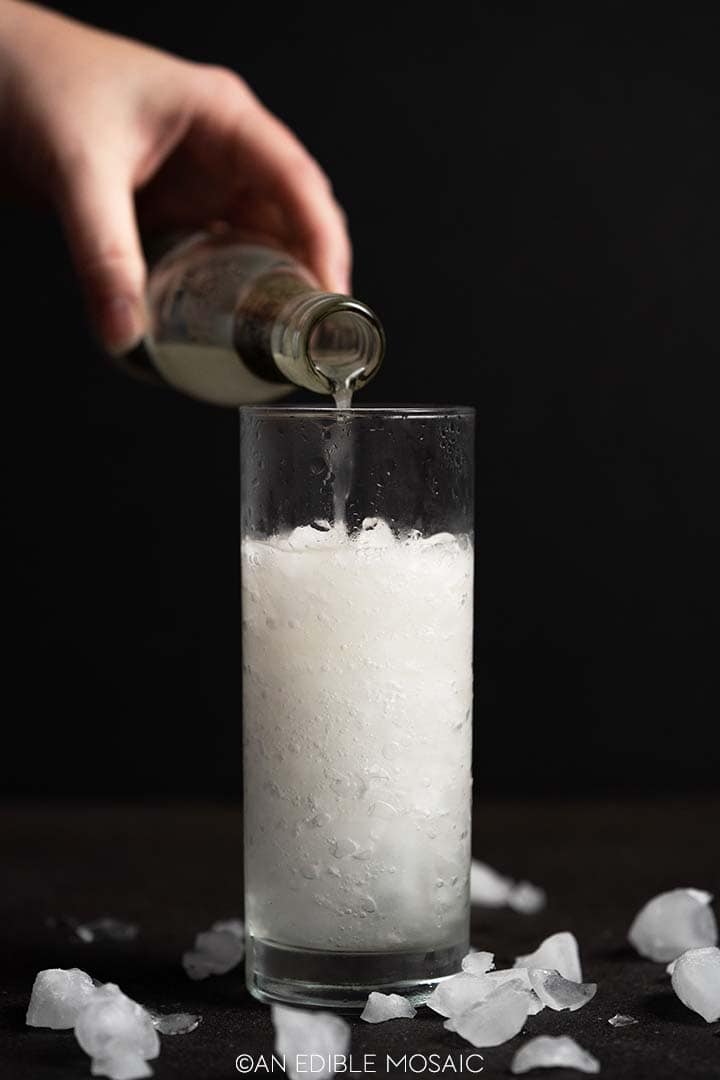 pouring ginger beer over ice