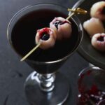 red wine sangria cocktail with bloody eyeballs for halloween featured image