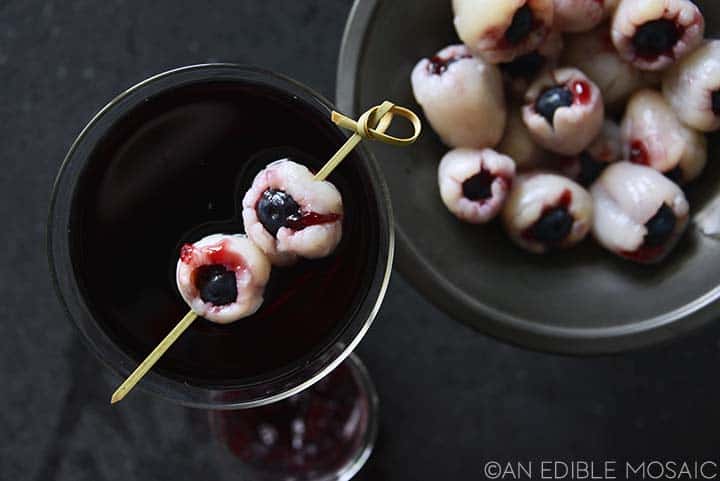 top view of halloween cocktail recipe with bloody eyeballs