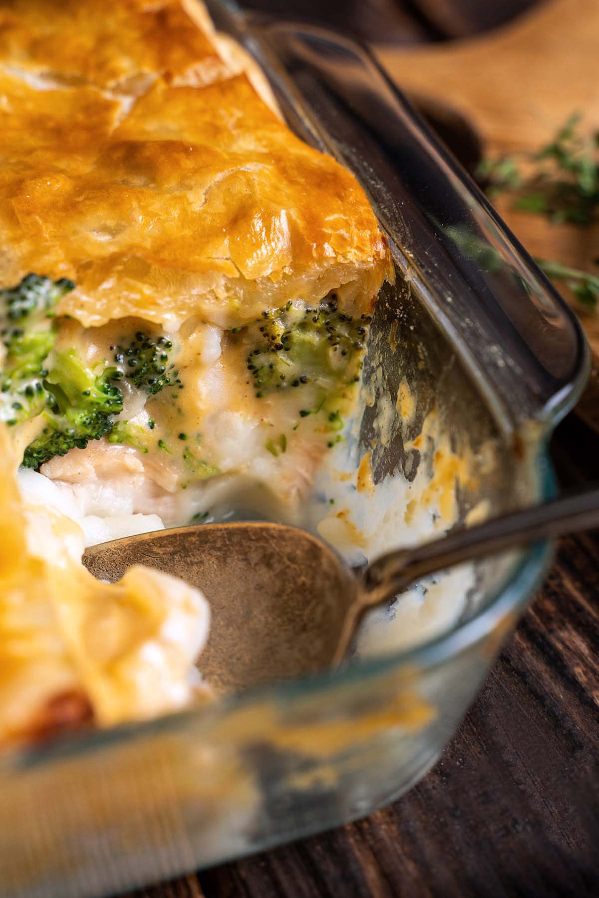 front view of thanksgiving leftovers casserole showing layers of turkey mashed potatoes broccoli and puff pastry