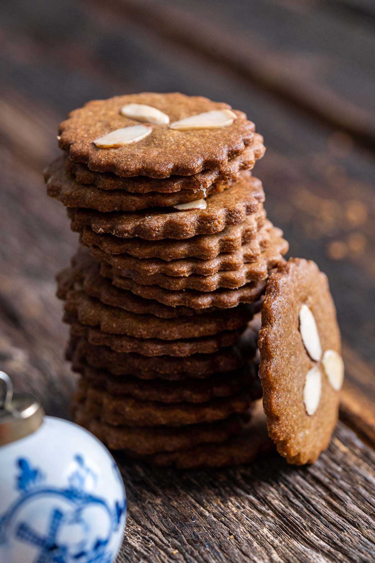 stack of spiced Dutch Christmas cookies with almonds
