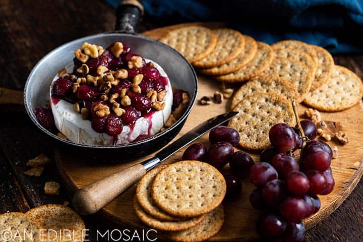 baked brie with honey roasted grapes and walnuts