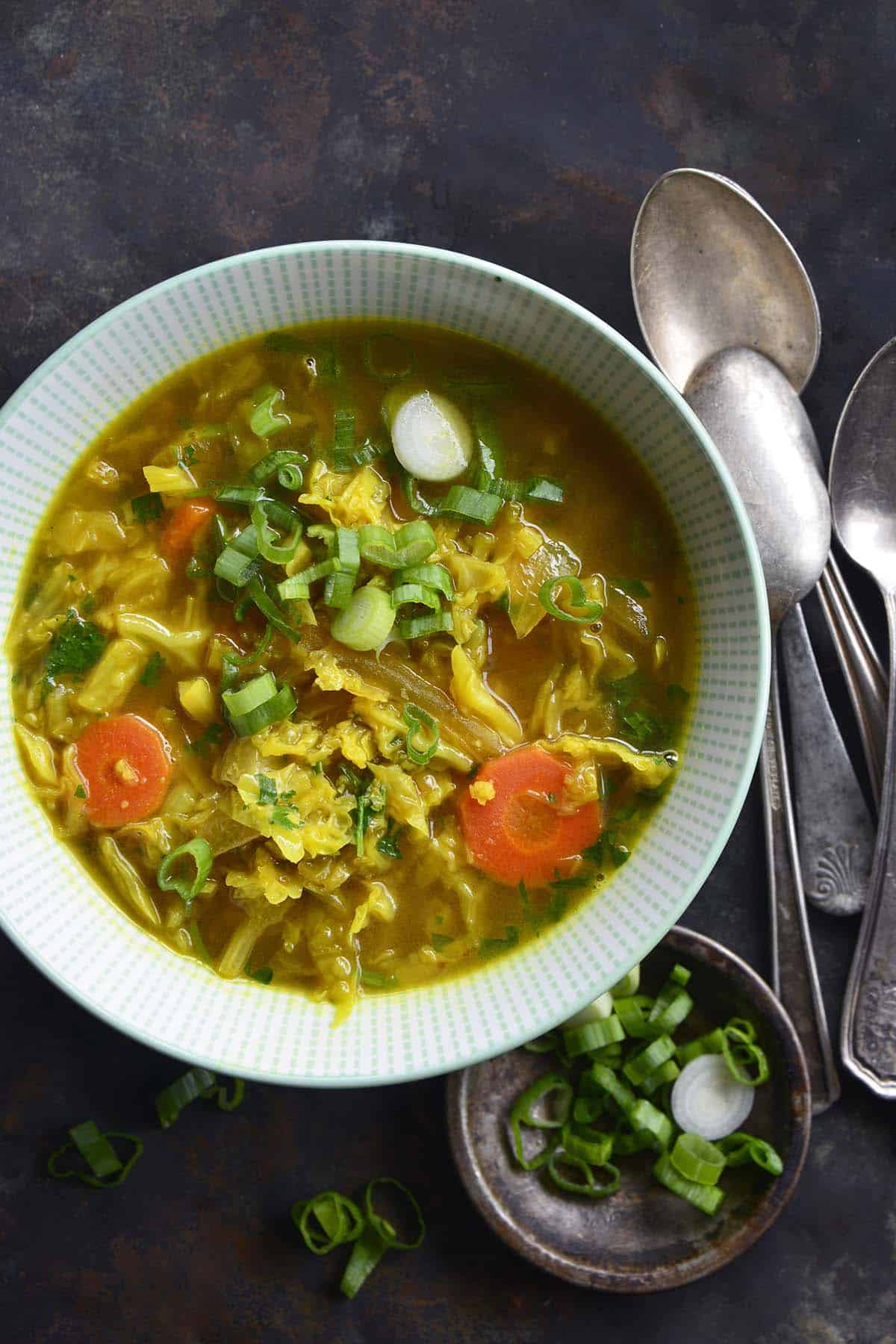 bowl of detox cabbage soup with vegetables