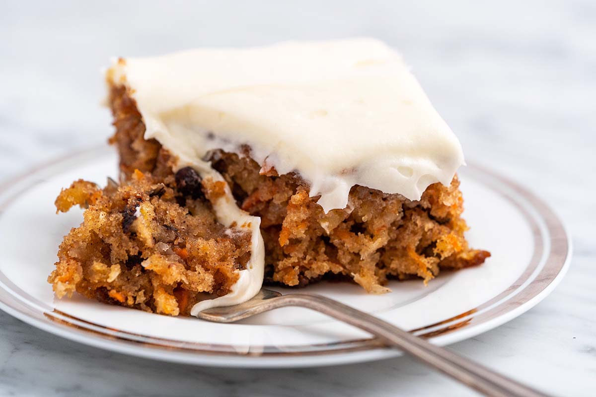 the best carrot cake recipe ever on plate to show moist texture