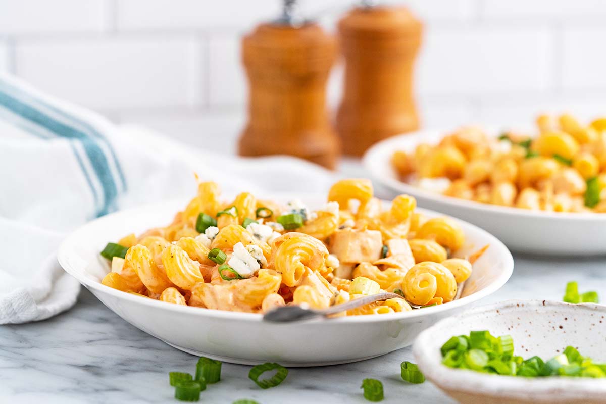 bowls of cold pasta salad with creamy ranch dressing