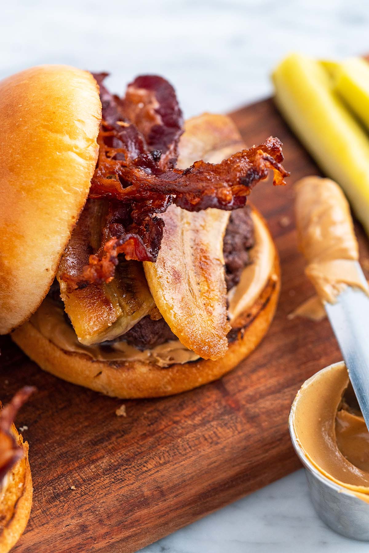 close up of elvis burger with caramelized banana peanut butter and bacon