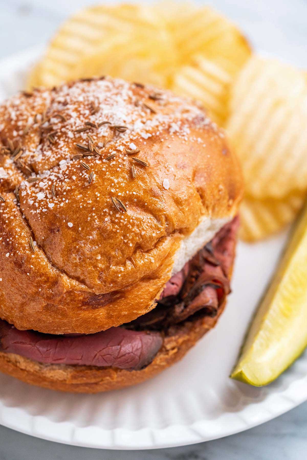 close up of roast beef on Kimmelweck roll
