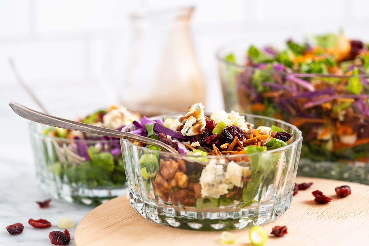 front view of chopped salad with nuts and cranberries