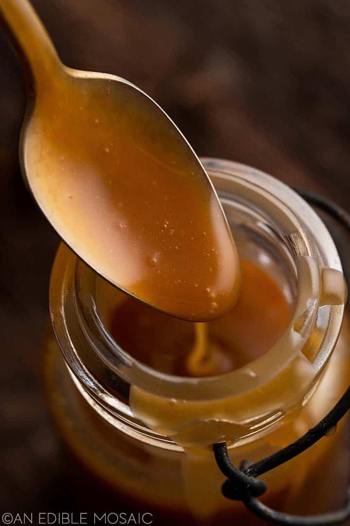 butterscotch sauce drizzling off spoon