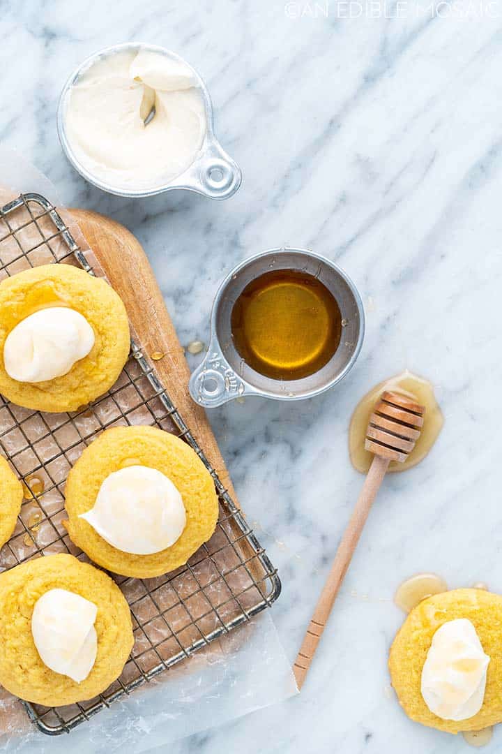 cornbread cookies on wire rack with buttercream and honey