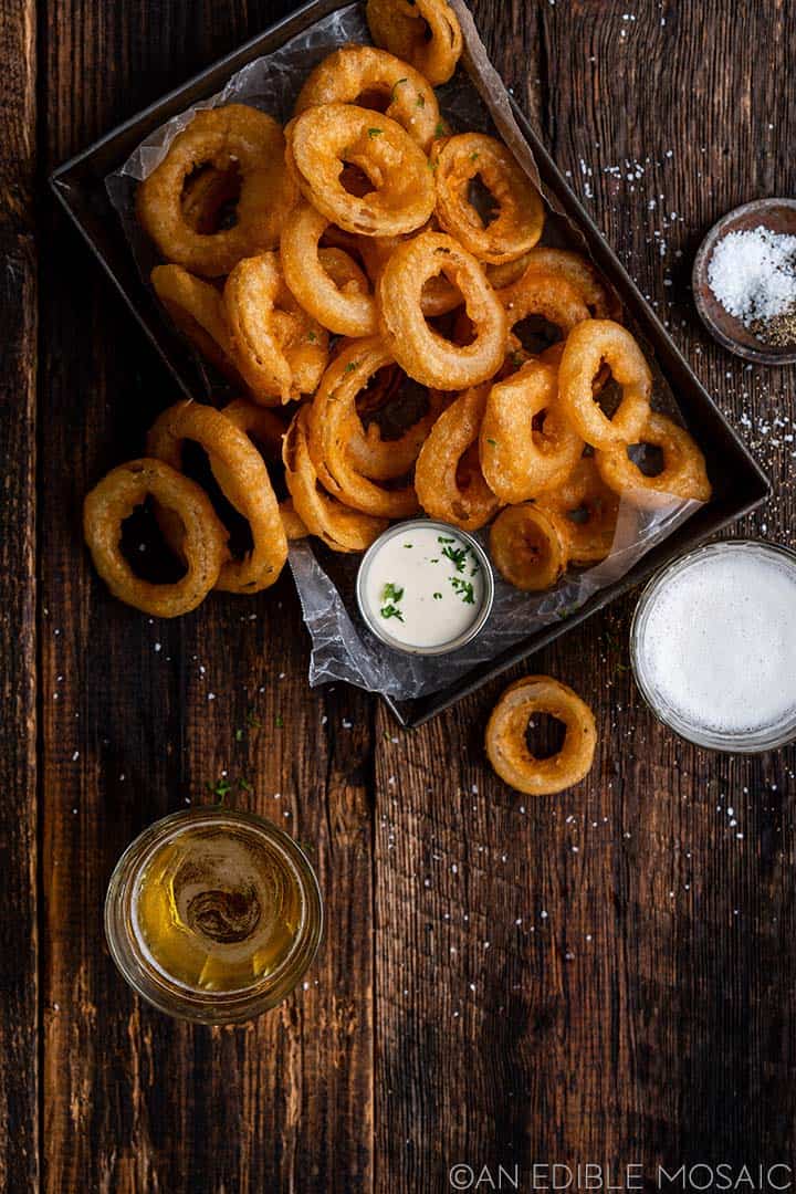 onion rings with ranch dressing on platter