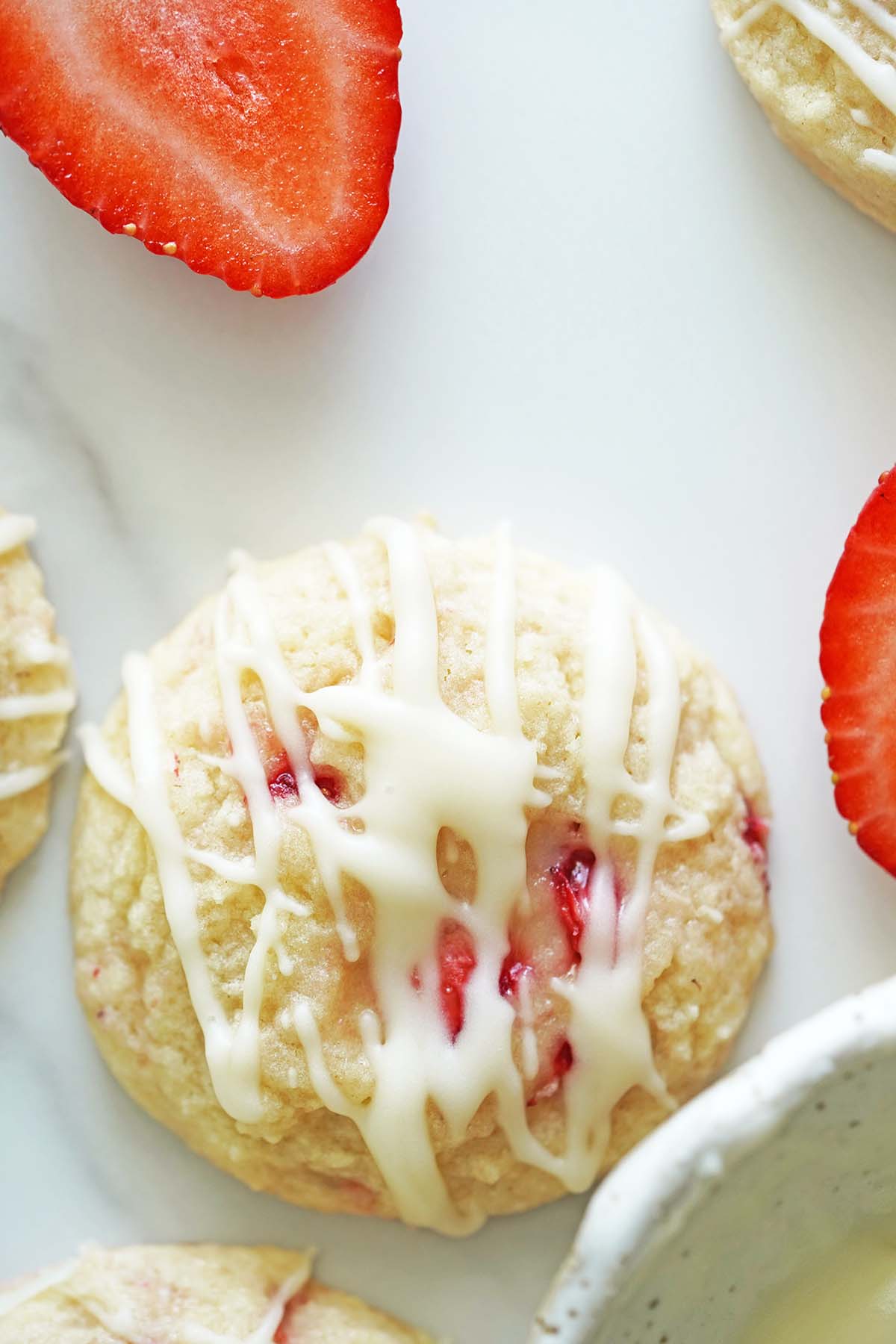 top view of homemade cookies with juicy strawberries