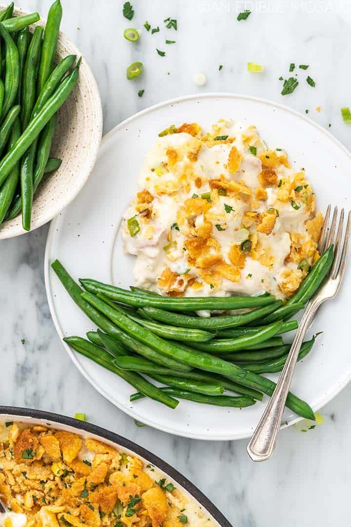 cheesy chicken casserole with green beans on plate