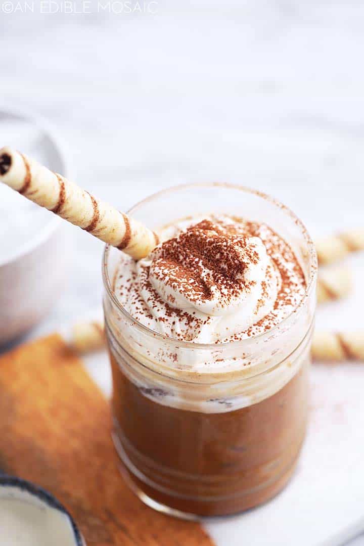 iced tiramisu latte topped with mascarpone cream and wafer cookie