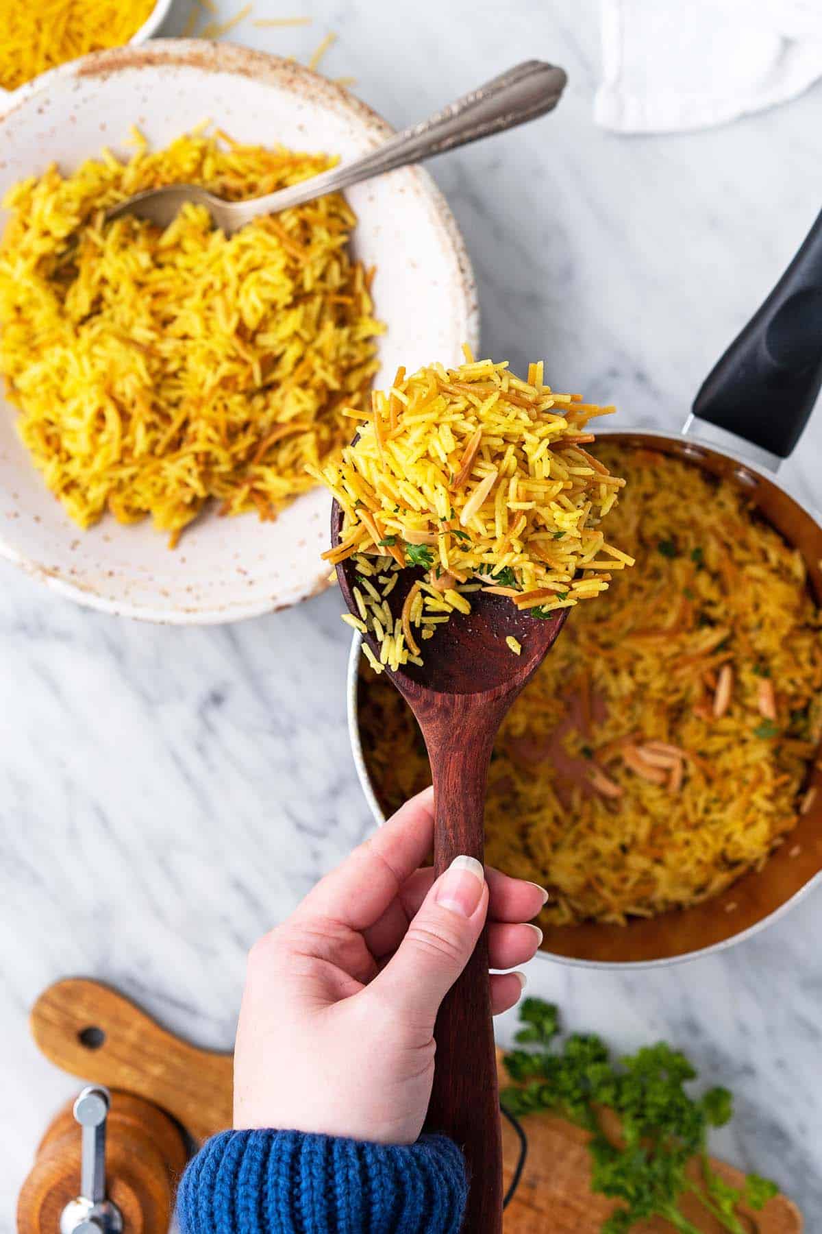 hand holding scoop of homemade rice a roni