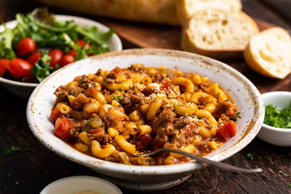 Johnny Marzetti casserole dinner with garden salad and bread