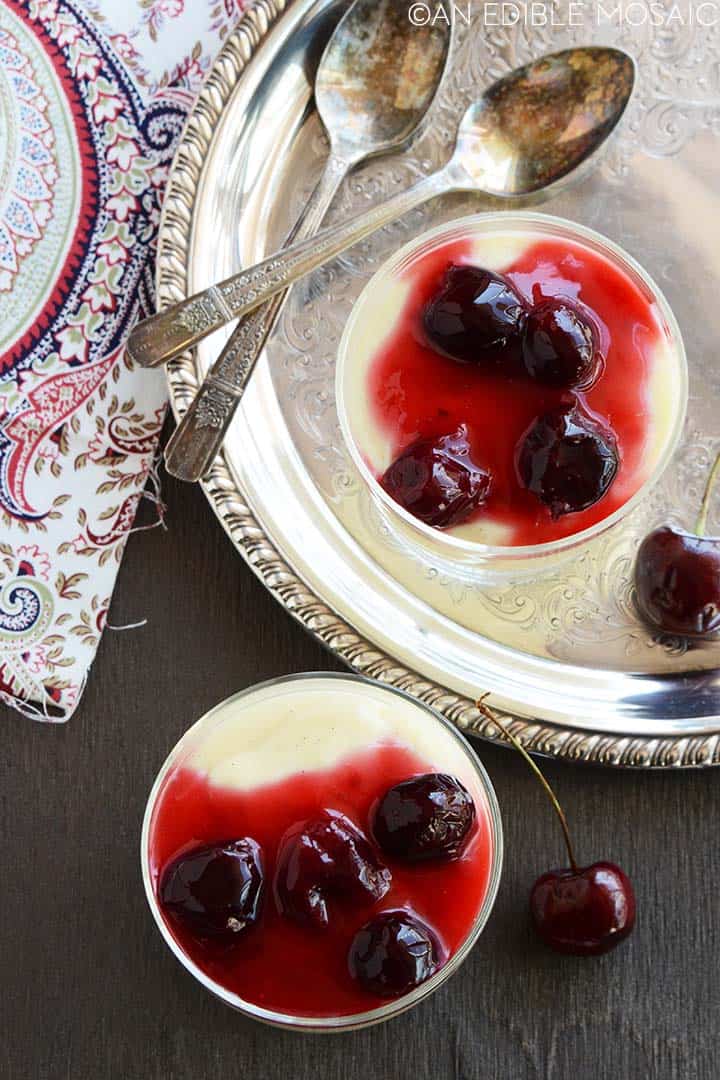 overhead view of vanilla pudding topped with cherry sauce