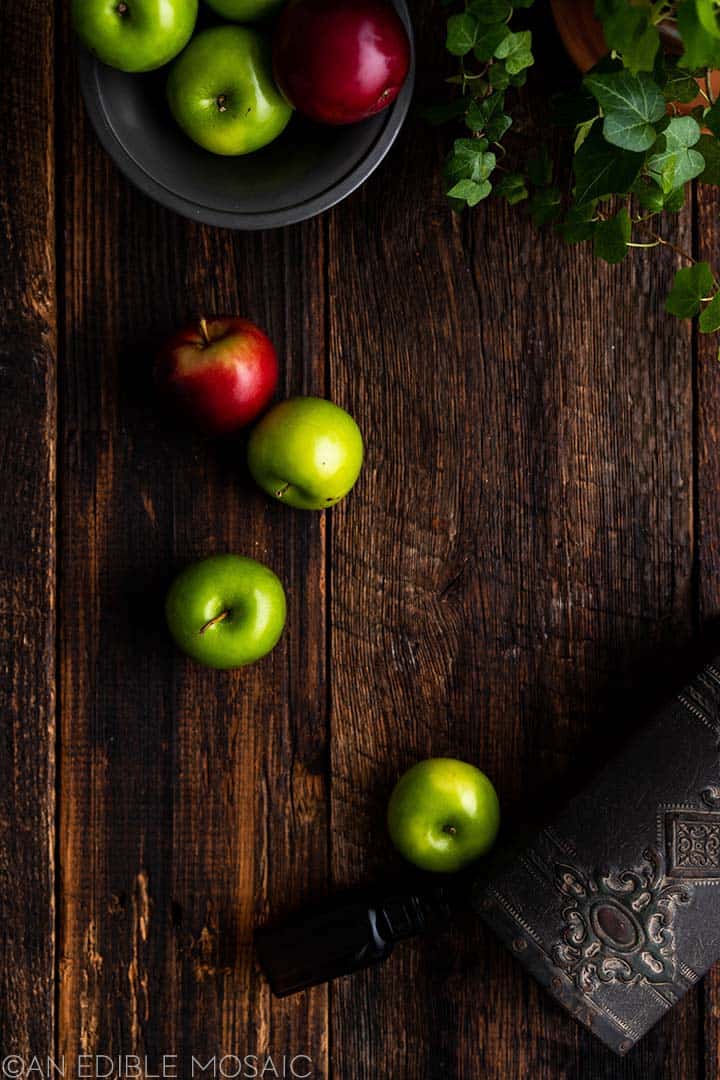 apples on dark wooden table