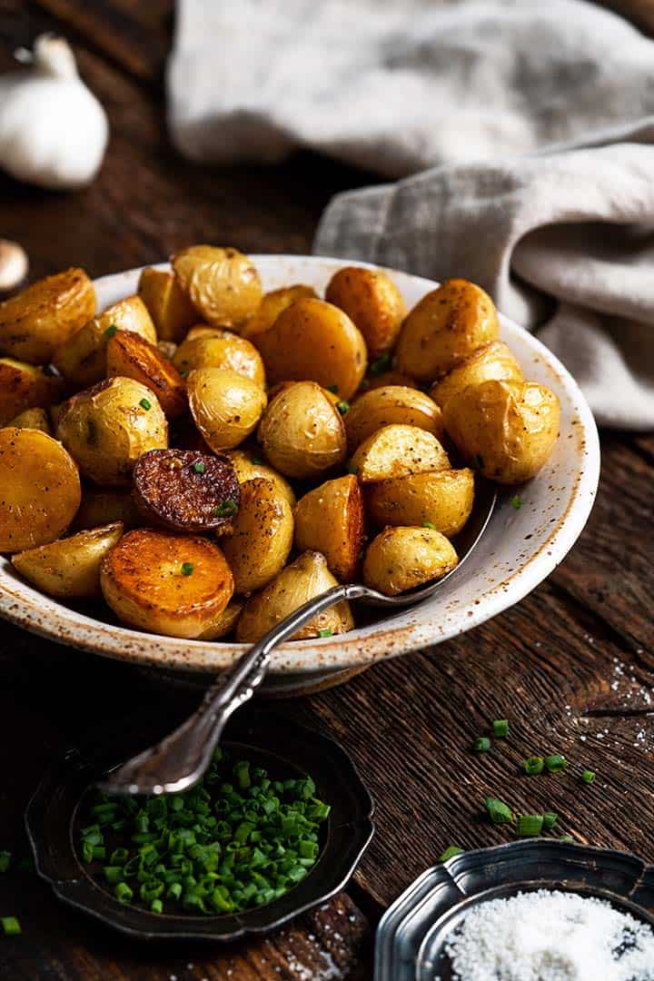 duck fat potatoes in stoneware bowl