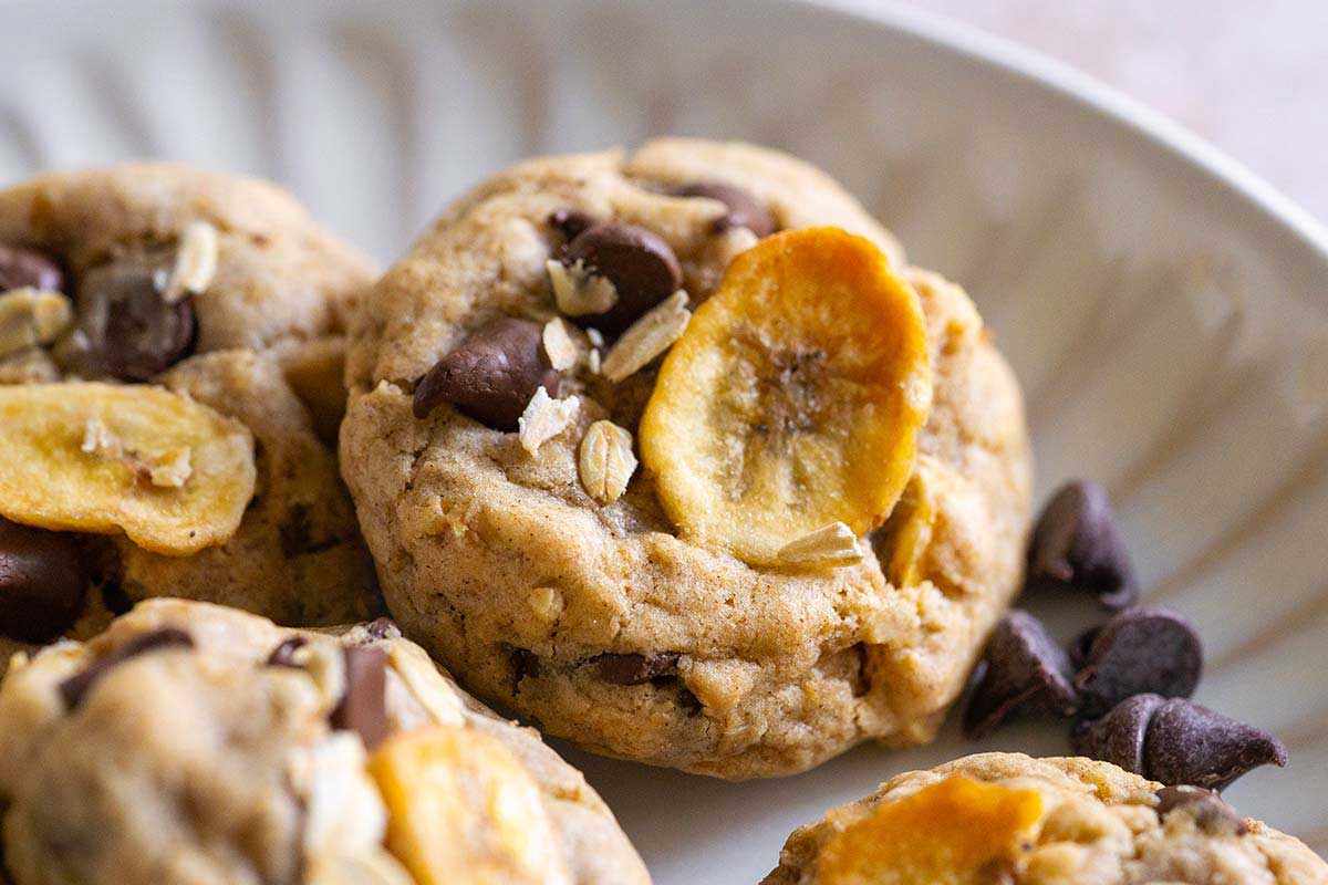 chewy chocolate chip cookies with banana chips and oatmeal on plate