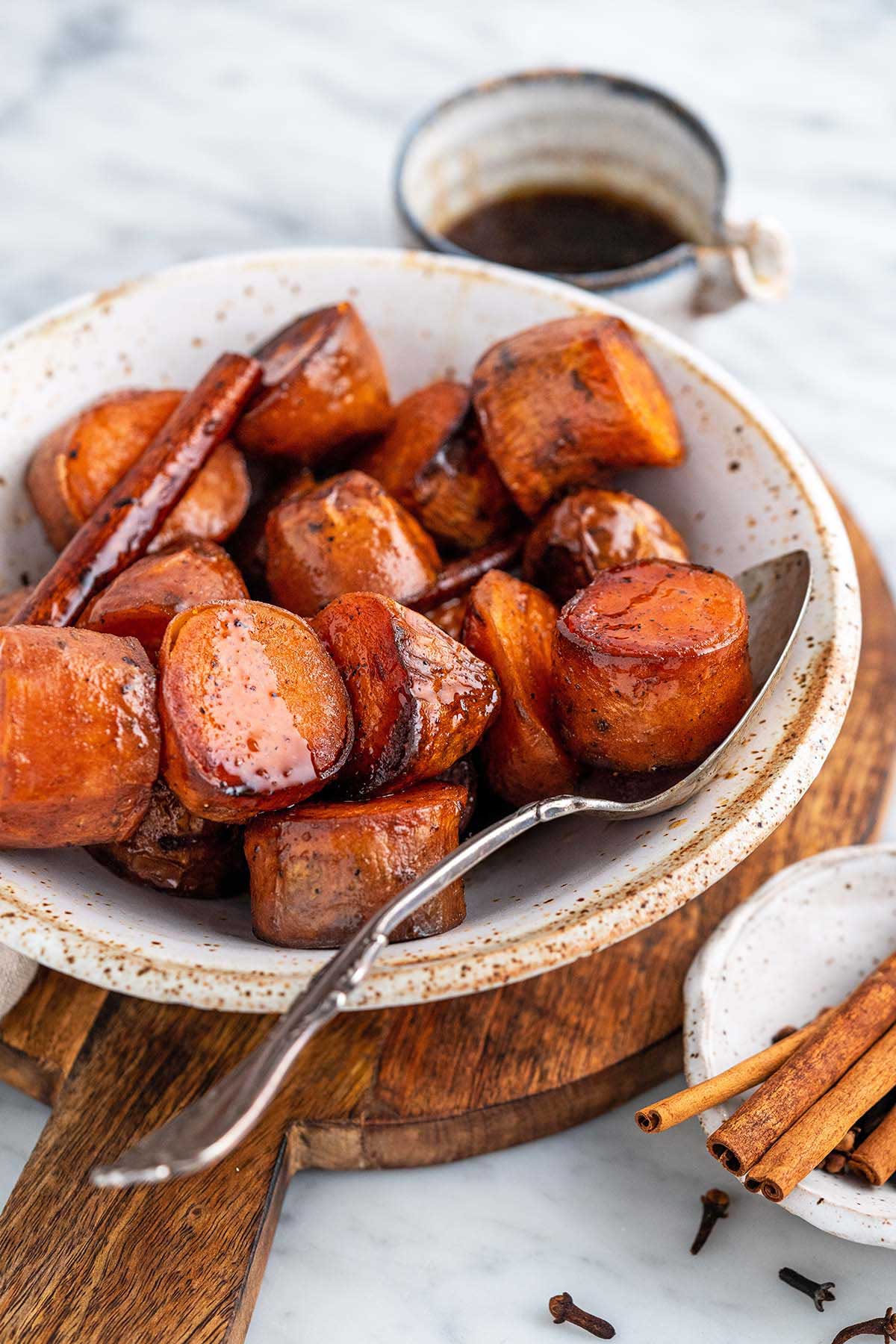 stoneware bowl with candied sweet potato cinnamon side dish
